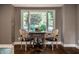 Bright study area featuring hardwood floors, a decorative rug, and a window with outdoor views at 7575 Central Ave, Indianapolis, IN 46240