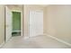 Comfortable bedroom with closet, carpet and access to on-suite bathroom at 7734 Hoover Rd, Indianapolis, IN 46260