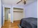 Comfortable bedroom with wooden floors and access to on-suite bathroom at 7734 Hoover Rd, Indianapolis, IN 46260