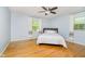 Serene bedroom retreat with hardwood floors, natural light, and relaxing ambiance at 7734 Hoover Rd, Indianapolis, IN 46260