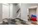 Finished basement features a staircase, storage closet, and unique multi-patterned carpeting at 7824 Hedgehop Dr, Zionsville, IN 46077