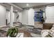 Open basement area with sliding barn door that offers a view of an office and unique stylish flooring at 7824 Hedgehop Dr, Zionsville, IN 46077