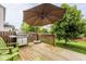 Enjoy outdoor living on this spacious deck with a grill, umbrella, and green Adirondack chairs at 7824 Hedgehop Dr, Zionsville, IN 46077