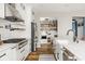 Beautiful modern kitchen with stainless steel appliances and a functional pantry at 7824 Hedgehop Dr, Zionsville, IN 46077