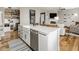 Open concept kitchen features an island and seamlessly connects to the living room at 7824 Hedgehop Dr, Zionsville, IN 46077
