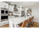 Modern kitchen features a large island, stainless appliances and abundant cabinet space at 7824 Hedgehop Dr, Zionsville, IN 46077
