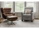 Comfortable living room showcasing stylish armchairs, large windows, and a plush rug at 7824 Hedgehop Dr, Zionsville, IN 46077