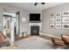 Cozy living room features a fireplace with mounted TV and lovely decor at 7824 Hedgehop Dr, Zionsville, IN 46077
