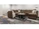 Cozy living room features a plush sectional sofa and stylish multi-patterned carpet at 7824 Hedgehop Dr, Zionsville, IN 46077