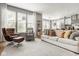 Bright and airy living room with large windows, a cozy sofa, and open floor plan at 7824 Hedgehop Dr, Zionsville, IN 46077
