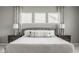 Bedroom with gray accents, tray ceilings, and natural lighting at 7824 Hedgehop Dr, Zionsville, IN 46077