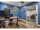 The office is equipped with hardwood floors and a unique custom wood-carved world map at 7824 Hedgehop Dr, Zionsville, IN 46077