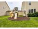 The spacious backyard offers a large playground set with slides and swings at 7824 Hedgehop Dr, Zionsville, IN 46077