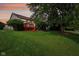 Home with a beautiful backyard and a charming red deck at 7970 Cobblesprings Dr, Avon, IN 46123