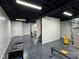 Spacious basement with gray walls, finished floor, and black painted exposed ceiling at 7970 Cobblesprings Dr, Avon, IN 46123