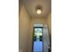 View from entryway showcasing door with storm door and view of front yard at 7970 Cobblesprings Dr, Avon, IN 46123