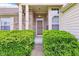 Inviting front entrance with a brick facade, complemented by lush greenery, creating a warm welcome at 7970 Cobblesprings Dr, Avon, IN 46123