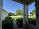 Covered front porch with a view of the manicured lawn and neighborhood, enhancing curb appeal at 7970 Cobblesprings Dr, Avon, IN 46123