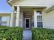 Inviting front porch with brick pillars, offering a warm welcome to this lovely home at 7970 Cobblesprings Dr, Avon, IN 46123