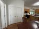 Kitchen with wood cabinets, appliances, view into breakfast nook, and double-door pantry at 7970 Cobblesprings Dr, Avon, IN 46123