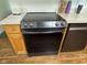 Stainless steel flat top range with wood cabinets and countertops at 7970 Cobblesprings Dr, Avon, IN 46123