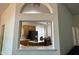 View of the kitchen and breakfast nook, as seen through an interior arched window at 7970 Cobblesprings Dr, Avon, IN 46123