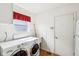 Bright laundry room featuring a washer and dryer set, window, and convenient sink and storage options at 7970 Cobblesprings Dr, Avon, IN 46123
