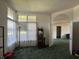 Open living space with neutral walls, carpet, and large windows for lots of natural light at 7970 Cobblesprings Dr, Avon, IN 46123