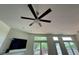 Living room featuring a ceiling fan and an abundance of natural light through the windows at 7970 Cobblesprings Dr, Avon, IN 46123