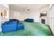 Spacious living room with fireplace, large windows, and comfortable blue seating at 7970 Cobblesprings Dr, Avon, IN 46123