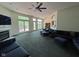 Spacious living room with large windows, fireplace, and comfortable seating at 7970 Cobblesprings Dr, Avon, IN 46123