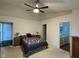 Spacious main bedroom with a ceiling fan, and ensuite bathroom with a vanity at 7970 Cobblesprings Dr, Avon, IN 46123