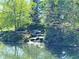Scenic water feature featuring a waterfall and rocks at 7970 Cobblesprings Dr, Avon, IN 46123
