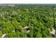Lush aerial view of secluded homes nestled among mature trees, providing privacy and a natural setting at 8209 Beech Knoll, Indianapolis, IN 46256