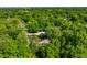 Stunning aerial view of the property nestled among lush green trees, providing ultimate privacy and seclusion at 8209 Beech Knoll, Indianapolis, IN 46256