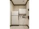 Basement kitchenette with white cabinets and appliances, offering convenience and functionality at 8209 Beech Knoll, Indianapolis, IN 46256