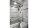 Contemporary bathroom with a glass-enclosed shower, sleek fixtures, and tiled walls at 8209 Beech Knoll, Indianapolis, IN 46256