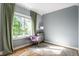Bedroom showcasing a large window with natural light and a decorative rug and chair at 8209 Beech Knoll, Indianapolis, IN 46256