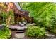 Multi-tiered deck with outdoor seating, and lush greenery providing a tranquil and inviting atmosphere at 8209 Beech Knoll, Indianapolis, IN 46256
