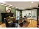 Elegant dining room features a fireplace, hardwood floors, and a large wooden table for entertaining at 8209 Beech Knoll, Indianapolis, IN 46256