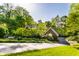 Charming two-story brick home with mature landscaping, garden, and an attached garage at 8209 Beech Knoll, Indianapolis, IN 46256