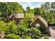 Beautiful exterior of a brick home surrounded by lush greenery, showcasing its classic design and curb appeal at 8209 Beech Knoll, Indianapolis, IN 46256