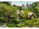 Beautiful home exterior with lush landscaping, showcasing architectural details and curb appeal at 8209 Beech Knoll, Indianapolis, IN 46256