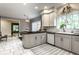 Open concept kitchen area featuring white cabinets and stainless appliances at 8209 Beech Knoll, Indianapolis, IN 46256
