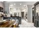 Bright kitchen featuring white cabinets and a gray island with seating at 8209 Beech Knoll, Indianapolis, IN 46256