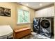 Efficient laundry room with modern washer and dryer, ample storage, and natural light at 8209 Beech Knoll, Indianapolis, IN 46256