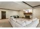Spacious living room featuring a large sectional sofa, fireplace and carpeted flooring, providing a cozy atmosphere at 8209 Beech Knoll, Indianapolis, IN 46256