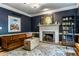 Inviting living room featuring a decorative fireplace and comfortable seating, ideal for relaxing at 8209 Beech Knoll, Indianapolis, IN 46256