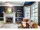 Cozy living room featuring a decorative fireplace with flowers and plants adding a touch of nature at 8209 Beech Knoll, Indianapolis, IN 46256