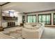 Inviting living room features a fireplace, large windows and comfortable seating, perfect for relaxation and entertaining at 8209 Beech Knoll, Indianapolis, IN 46256